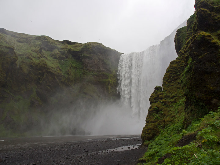 large waterfall at skaftafell park in iceland